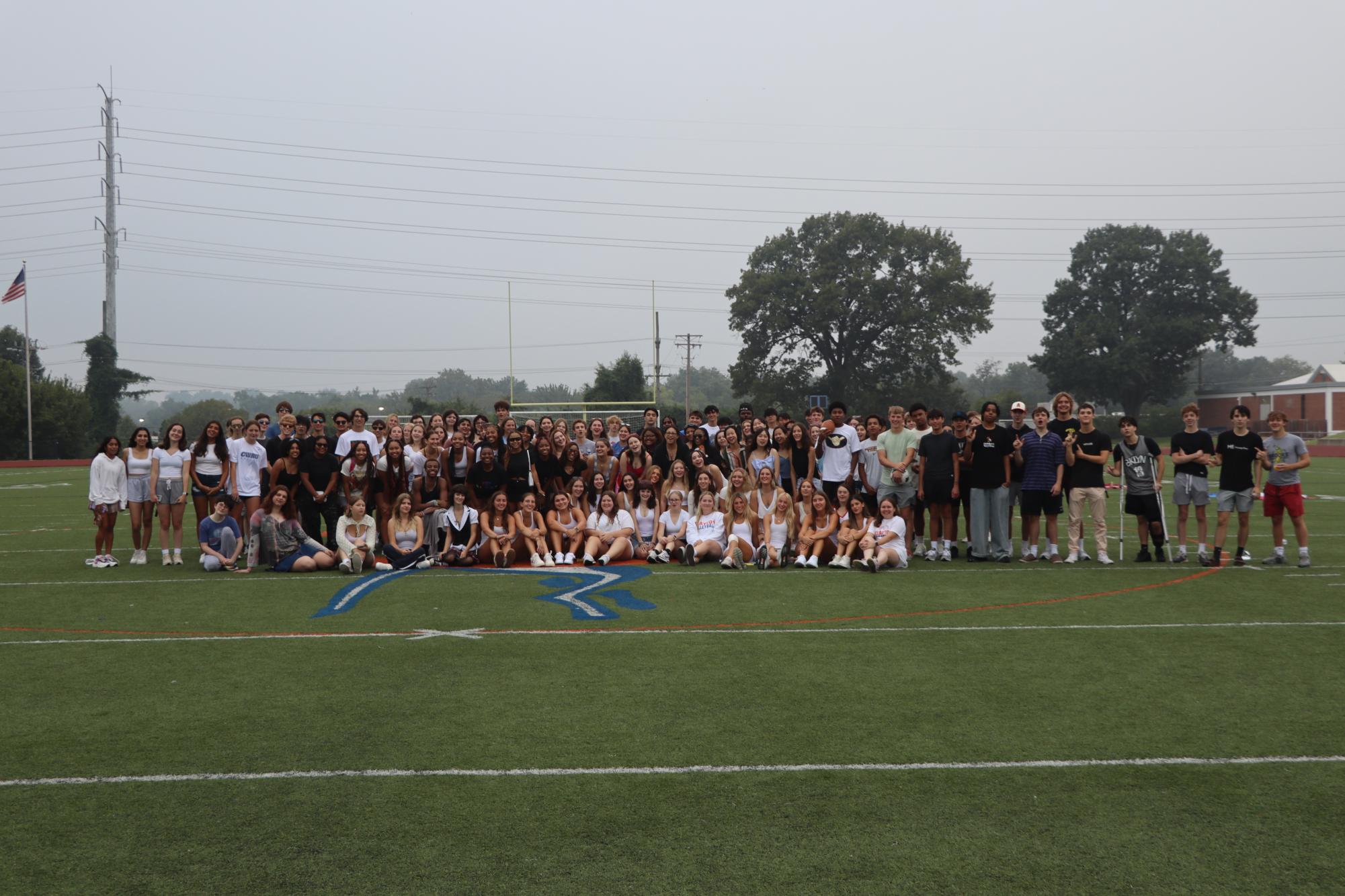 The class of 2024. Gathering two hours before the bell, seniors reunited with friends on Gay Field, Monday, Aug. 21, starting the last first day. The heat index reached 117 degrees, and the sky was obscured by fog. Senior Bora Saner said. “I am both so excited and nervous about leaving school. I am sad about parting ways with my friends.”