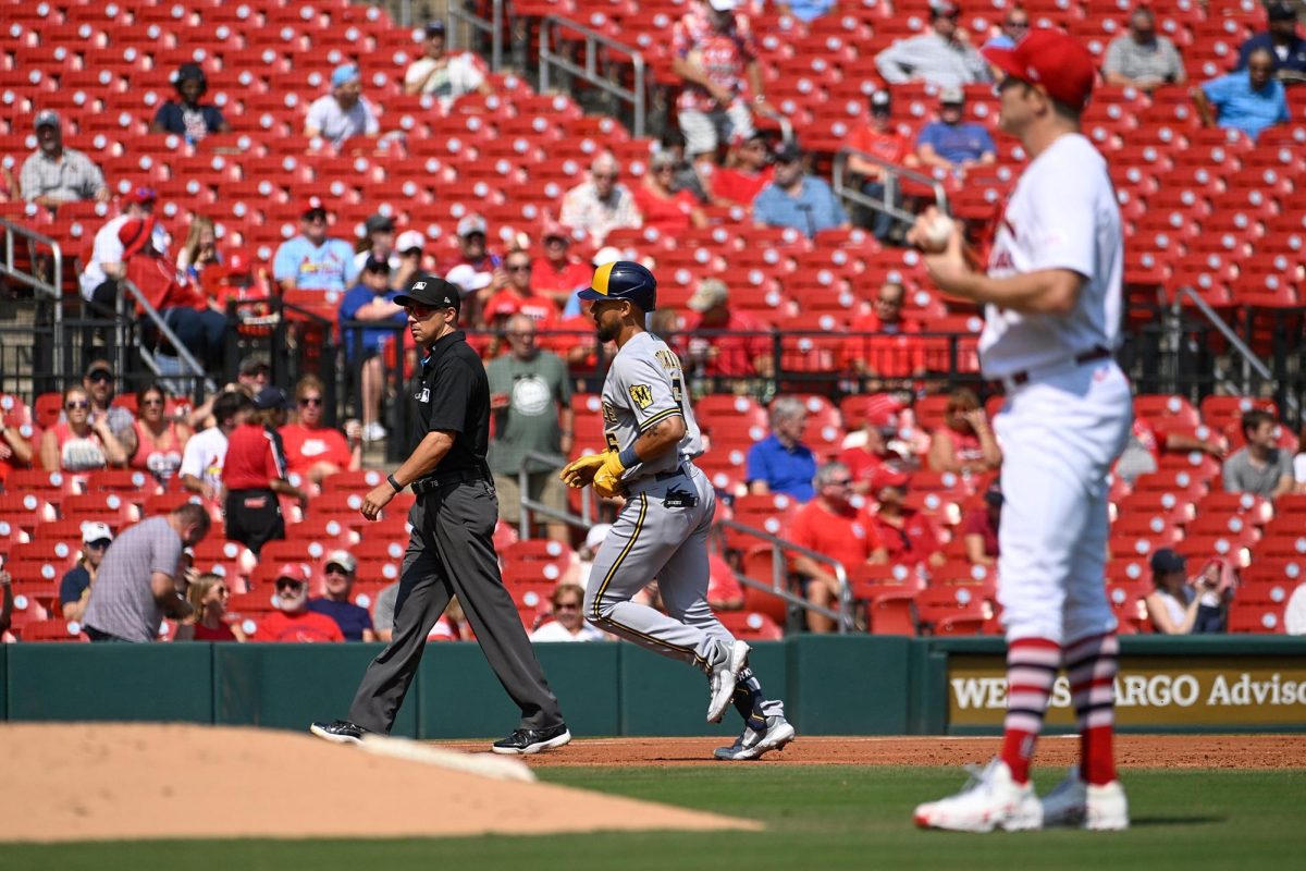 The Milwaukee Brewers Blake Perkins, middle, rounds the bases after hitting a solo home run against St. Louis Cardinals pitcher Miles Mikolas, right, in the third inning at Busch Stadium on Thursday, Sept. 21, 2023, in St. Louis.