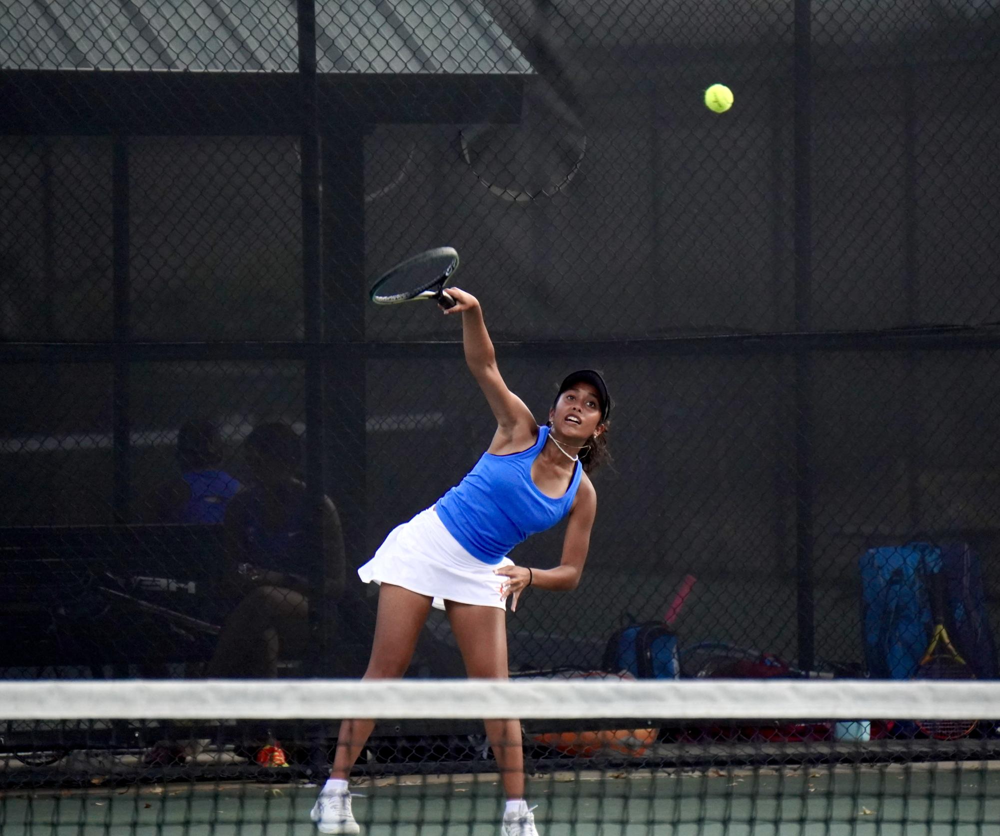 Senior Simone Sah serves the ball in a match on Sept. 21 against Ladue. This match prepared her for her eventual victory at state.
