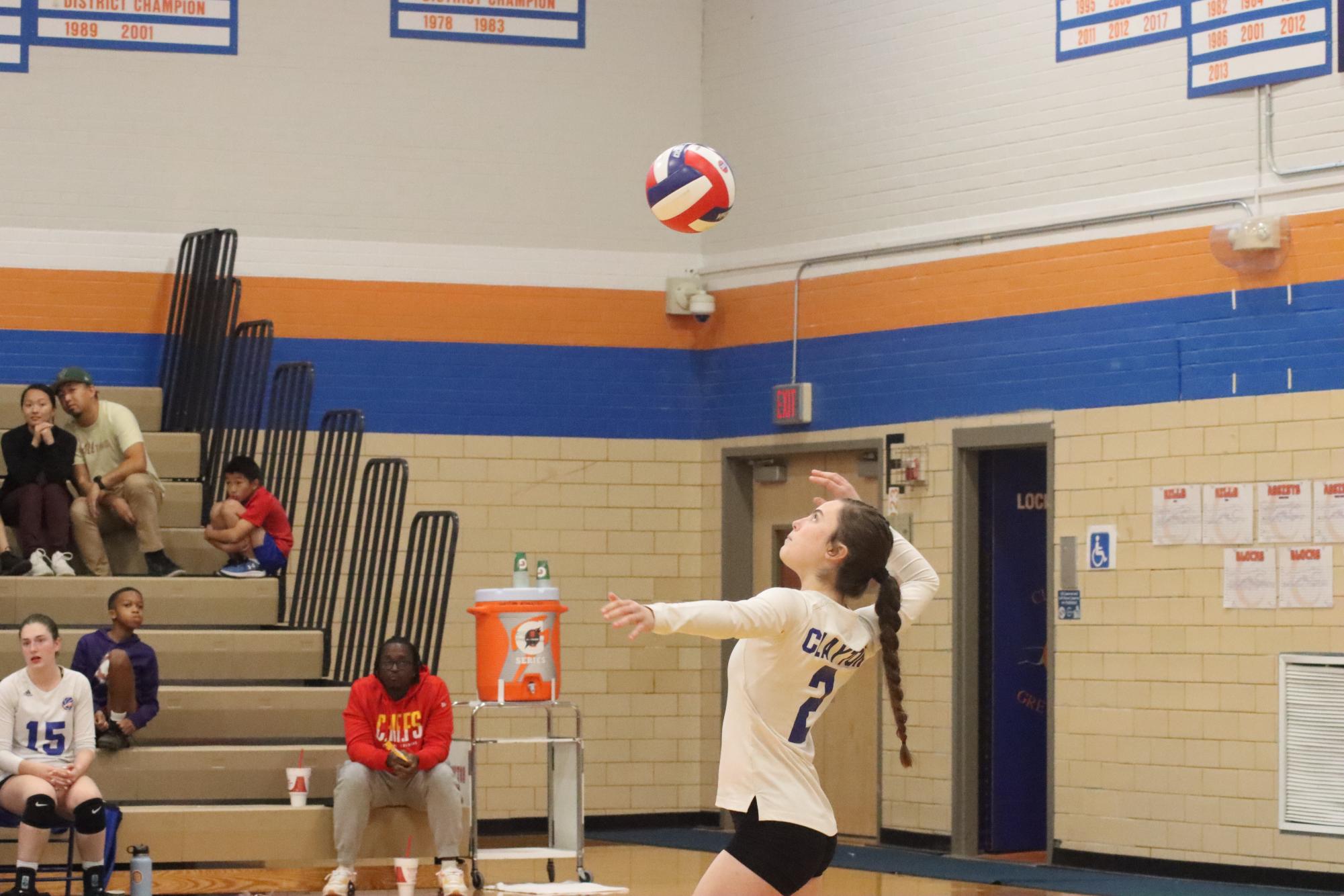 The final playoff game, junior Iselin Haldimann serves the ball into play. On Oct. 24, the CHS girls varsity volleyball beat MICDS to win the district championship title.