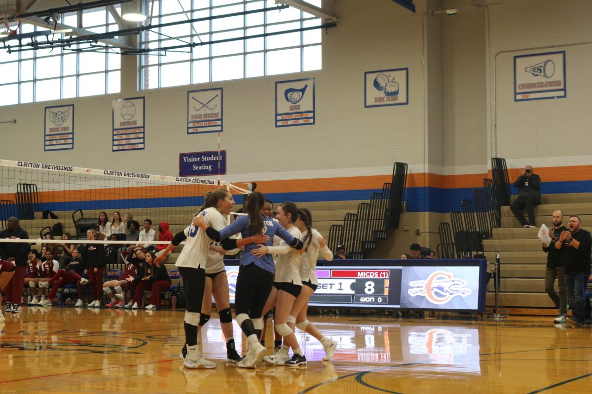 Varsity quarterfinal round. The team celebrates a successful kill. On October 26th, the girls volleyball team played in districts, barely losing to Blair Oaks