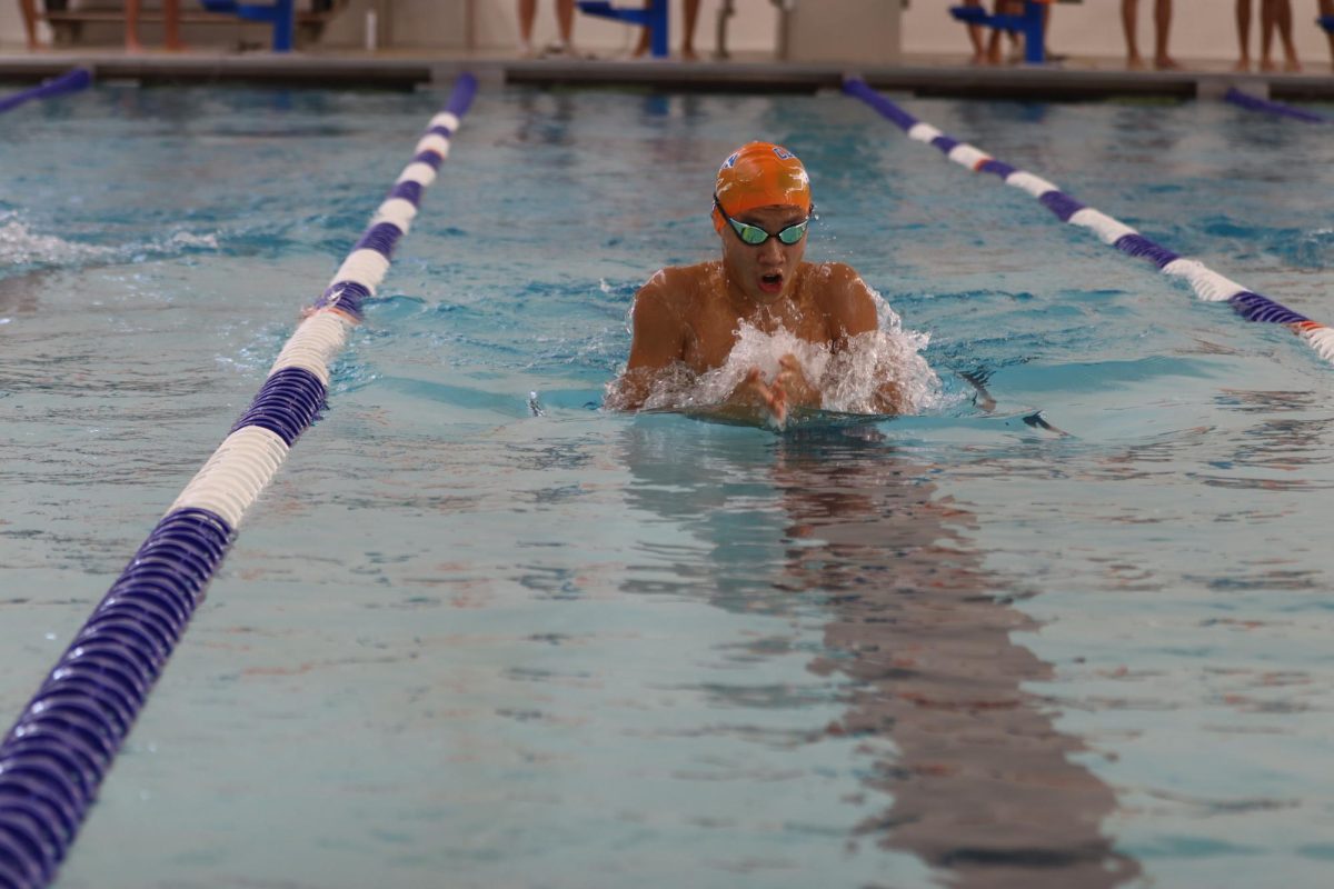 Sophomore Wenxu Yin competes in the 100 breaststroke during a home meet against Lindbergh High School on Sept. 7. The competition concluded with both the Greyhounds and the Flyers scoring 88 points, resulting in a tied final score.