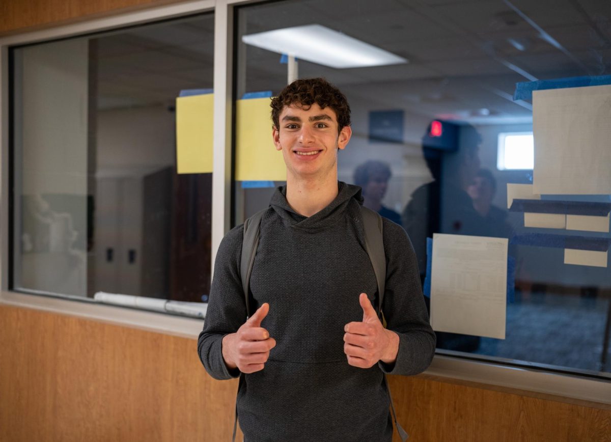 CHS Senior Blake Feinstein poses in front of the new Wellness Center. The space is located across from the art classrooms in the old bookstore. 