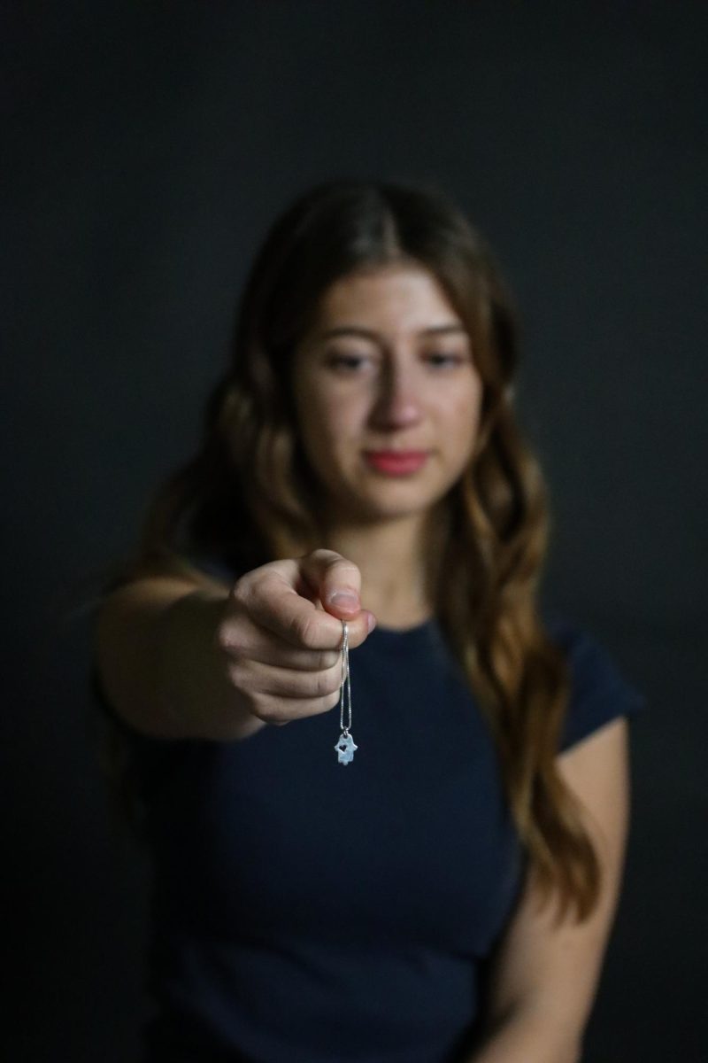 Molly Siwak holds necklace she bought from a jewler in Israel.