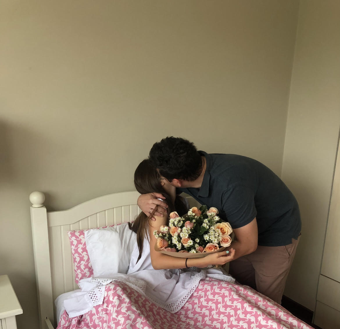 Lucia and her dad embrace as he gifts her with pink roses for her birthday. Flowers are a sign of love and gratitude in the Lerena family. 