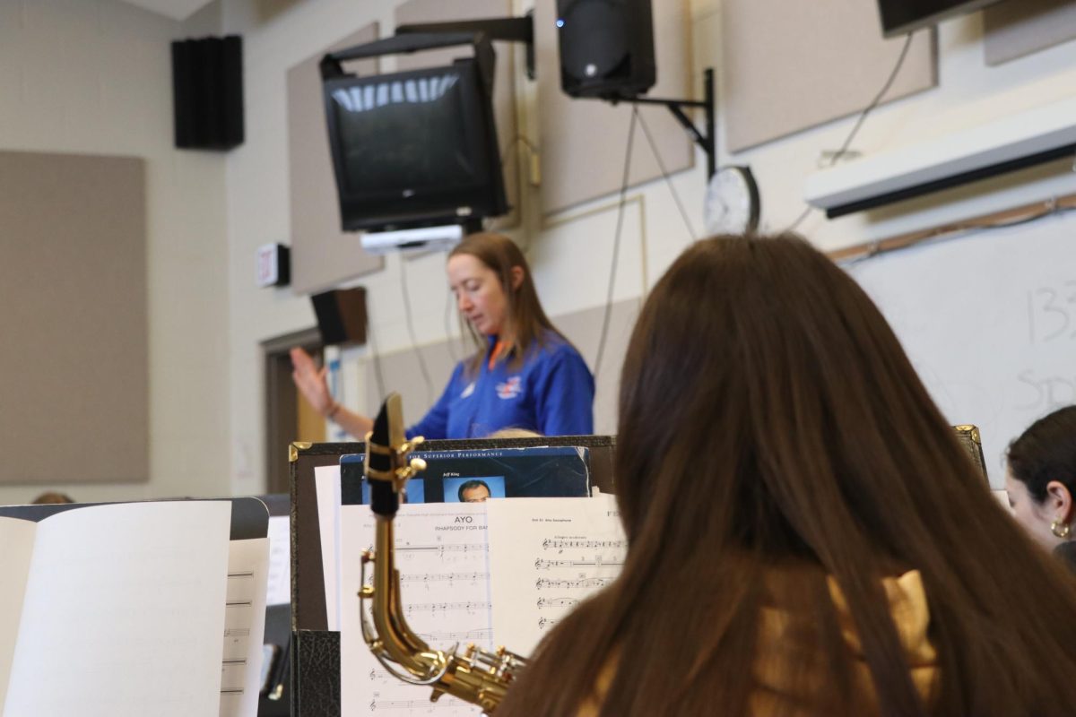 Band Director Alyssa Overmann leads an ensemble through rehearsal. The performers participated in Band Day ahead of the significant MSHSAA state contest. 
