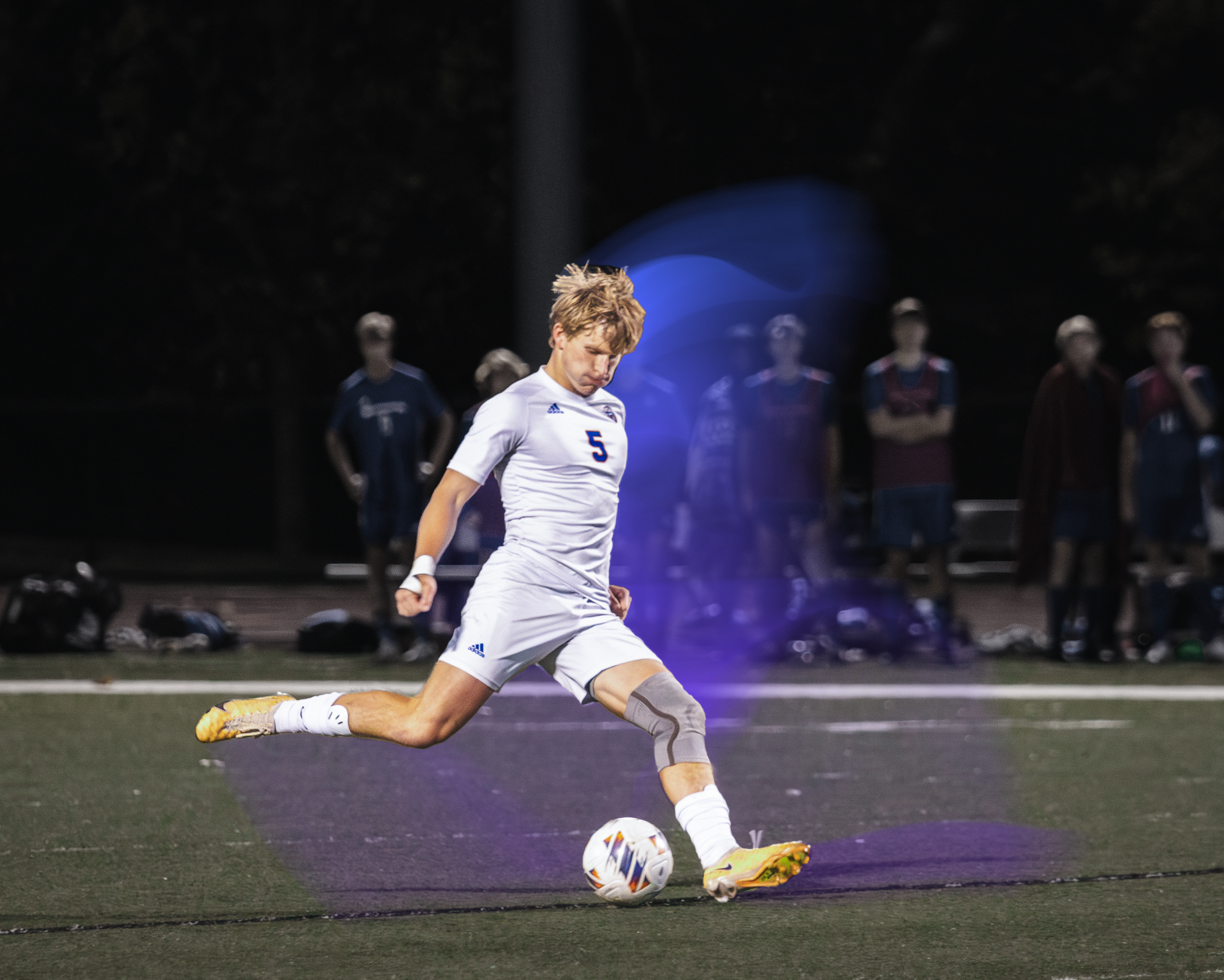 Beacan Mottl kicks the ball in front of the opposing team.