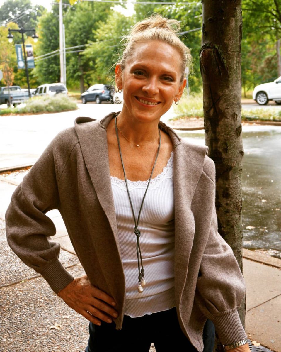 Owner Alyson Garland stands outside her store, Dot Dot Dash, showcasing her clothing collection. Photo courtesy of Dot Dot Dash.