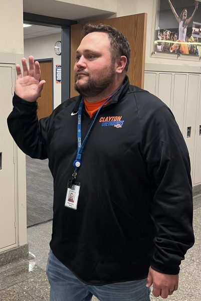 Special Education teacher Mr. Kuehn waves to students in the hall. Its easier to connect with students when you have the personal relationship with them, Kuehn said. If you just talk to them about work and homework and schoolwork, thats not very fun.