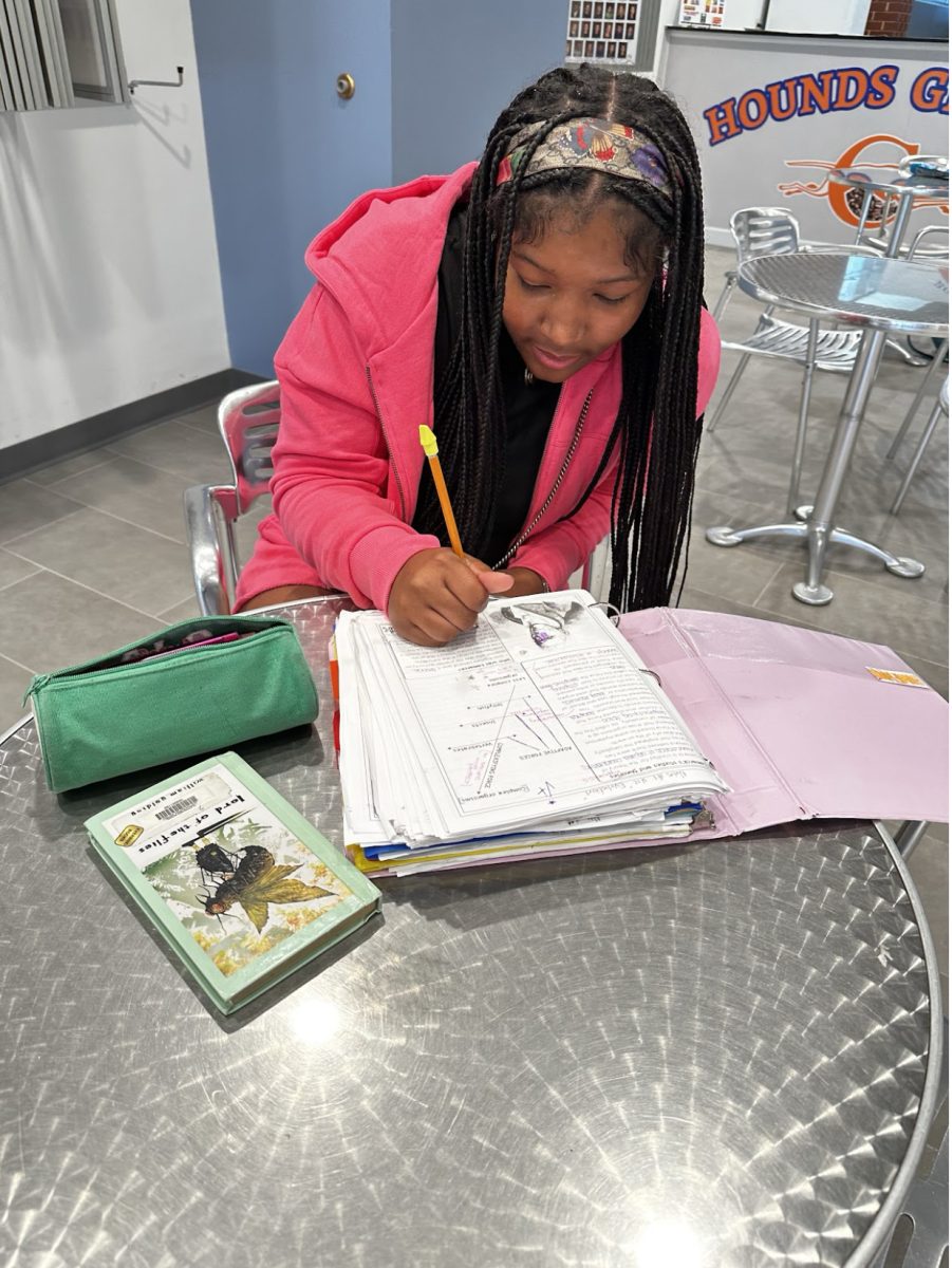 Freshman Kennedy McGowan does her homework during her lunch period. 