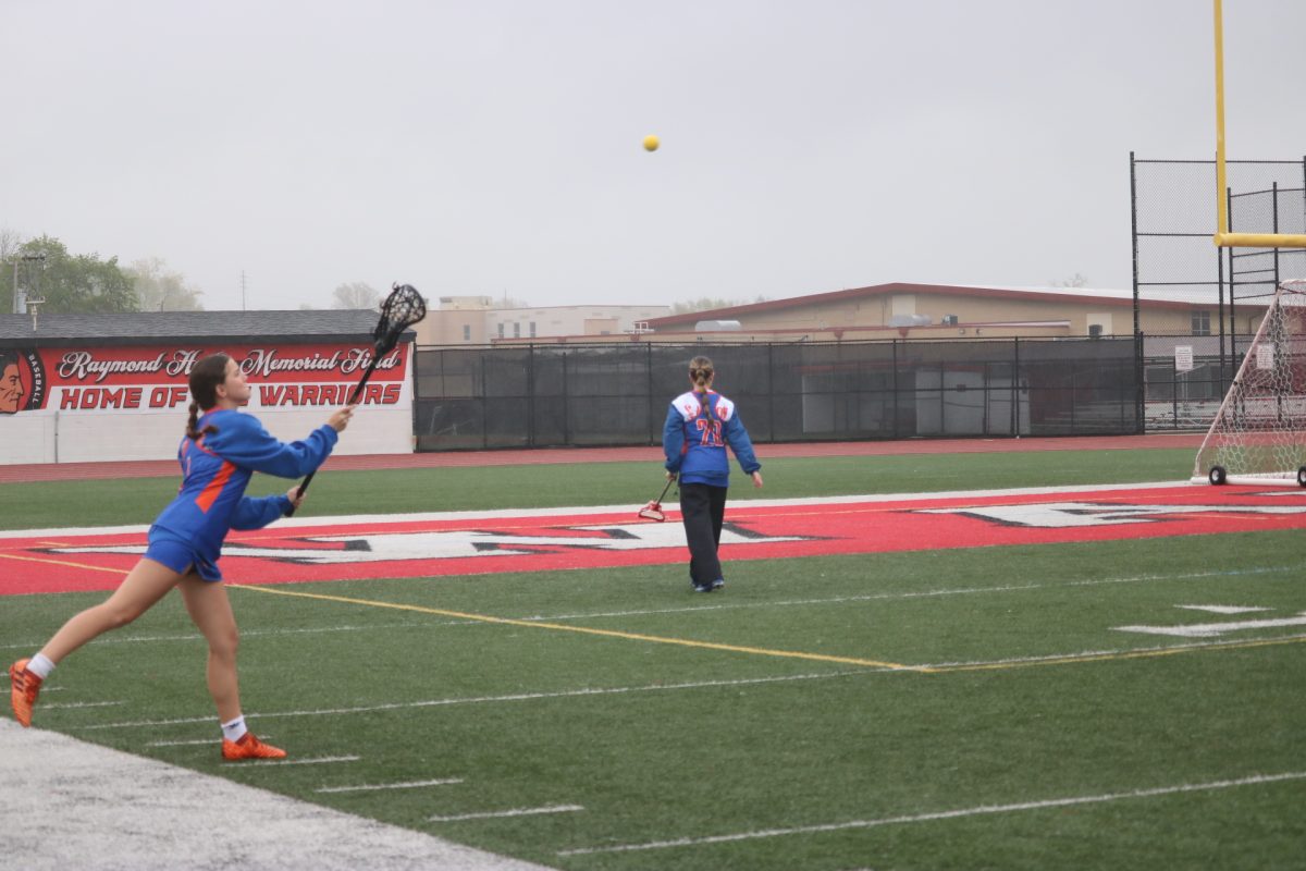 The Clayton girls lacrosse team warms up before facing Fox on April 10. The Greyhounds emerged victorious with a 9-6 win.