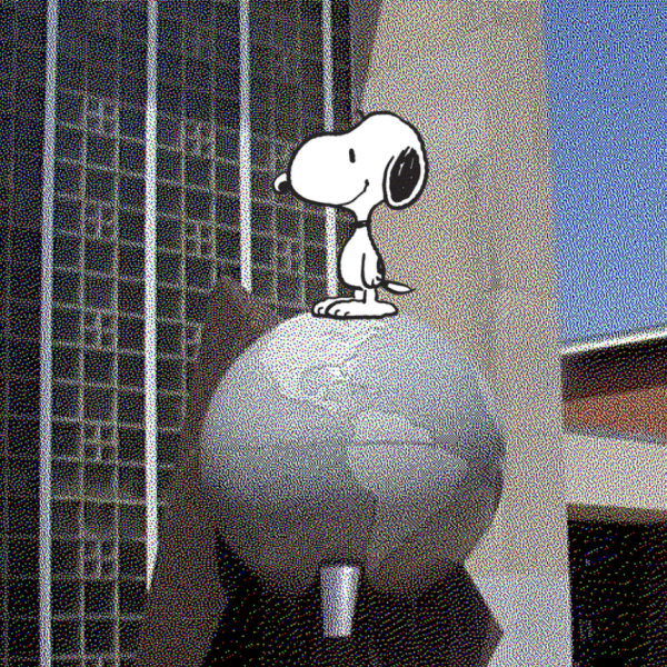 A Snoopy illustration stands on the globe statue at CHS entrance.