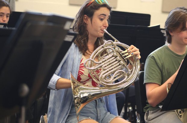 Senior Noa BenShahar plays her French horn in band class. “A memorable moment happened just yesterday. All upper brass were learning how to double tongue which is surprisingly difficult. It was fun for all of us to struggle together,” BenShahar said. “Band is great because all of us have to be somewhat on the same level to create a good sound, if one of us is off, [everyone] is off. As Mrs. Overmann says, ‘Band is the ultimate team sport.’”