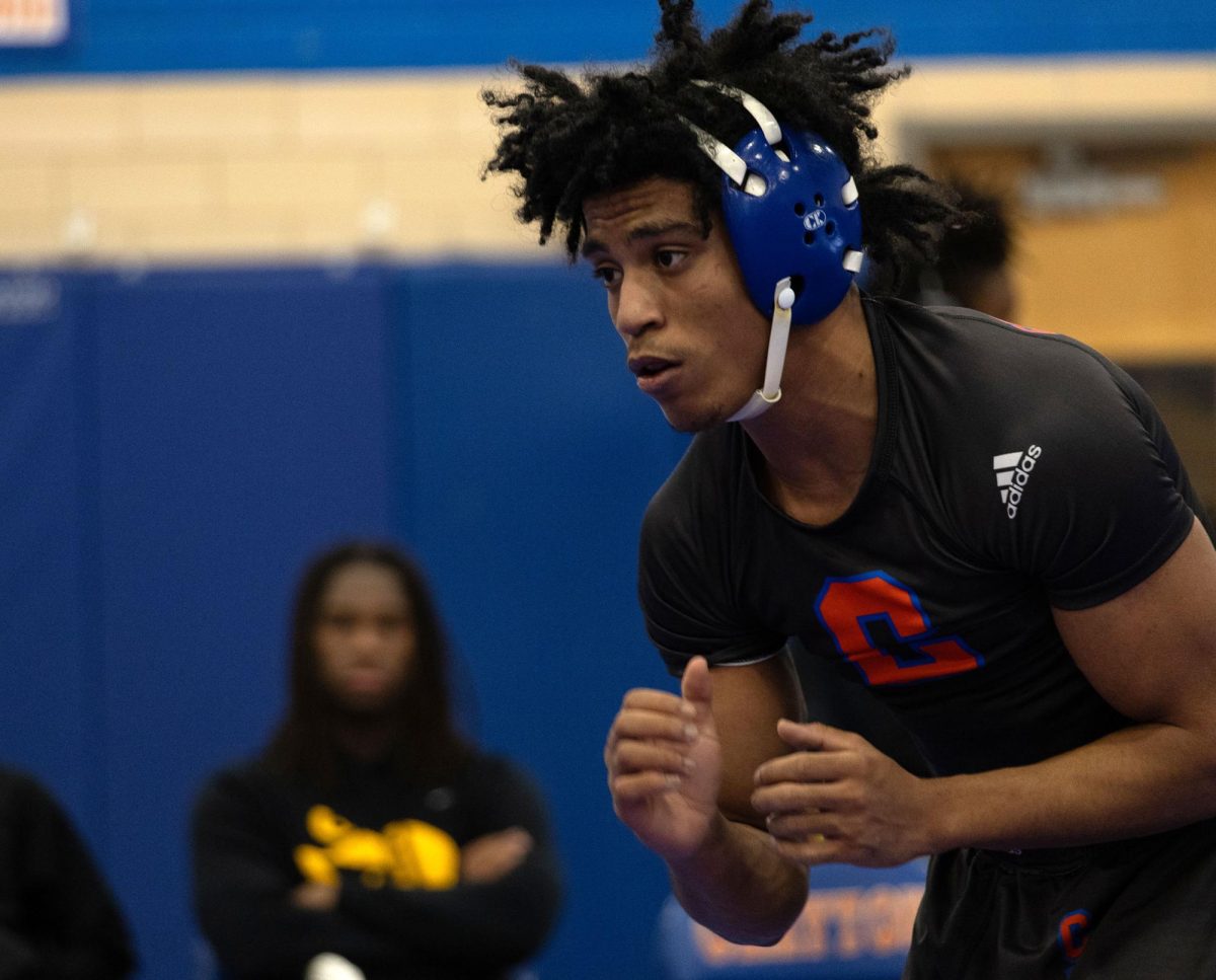 Senior Isaiah Reed wrestles on senior night against Ladue and Hazelwood Central on Feb. 5.