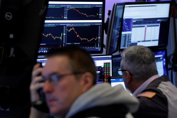Traders work on the floor at the New York Stock Exchange (NYSE) in New York City, U.S., February 24, 2025.  REUTERS/Brendan McDermid