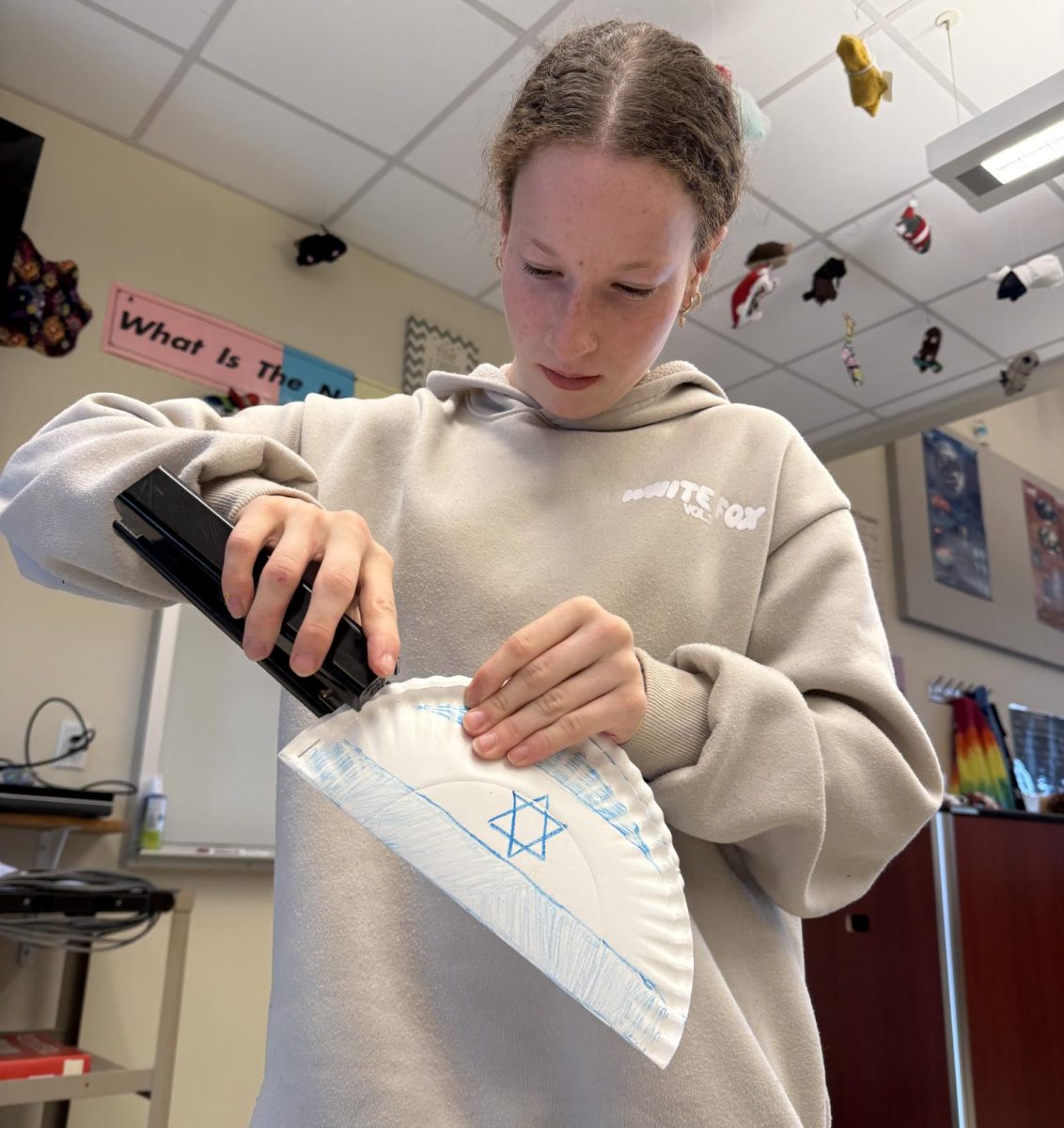 Sophomore Audrey Fine made a Purim grogger in JSU on Tuesday, Mar. 4. A grogger is a noisemaker that's often made from a paper plate, cup or other container filled with beans, rice or other small items. Groggers are used to make noise during the recitation of the Megillah on the Jewish holiday, Purim.