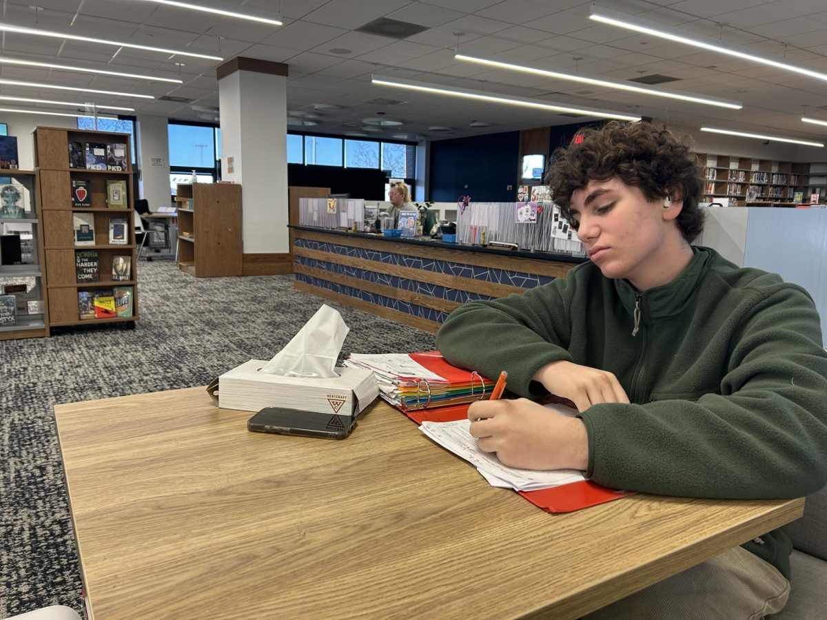8:34 a.m.
Freshman Vincent Altamuro studies for a Physics unit test on energy. After the Physics Lab class, Altamuro went to the library to prepare for a test he had March 11. “I liked to go over my old homework before a test and check my answers to make sure I know what I’m doing,” Altamuro said.
