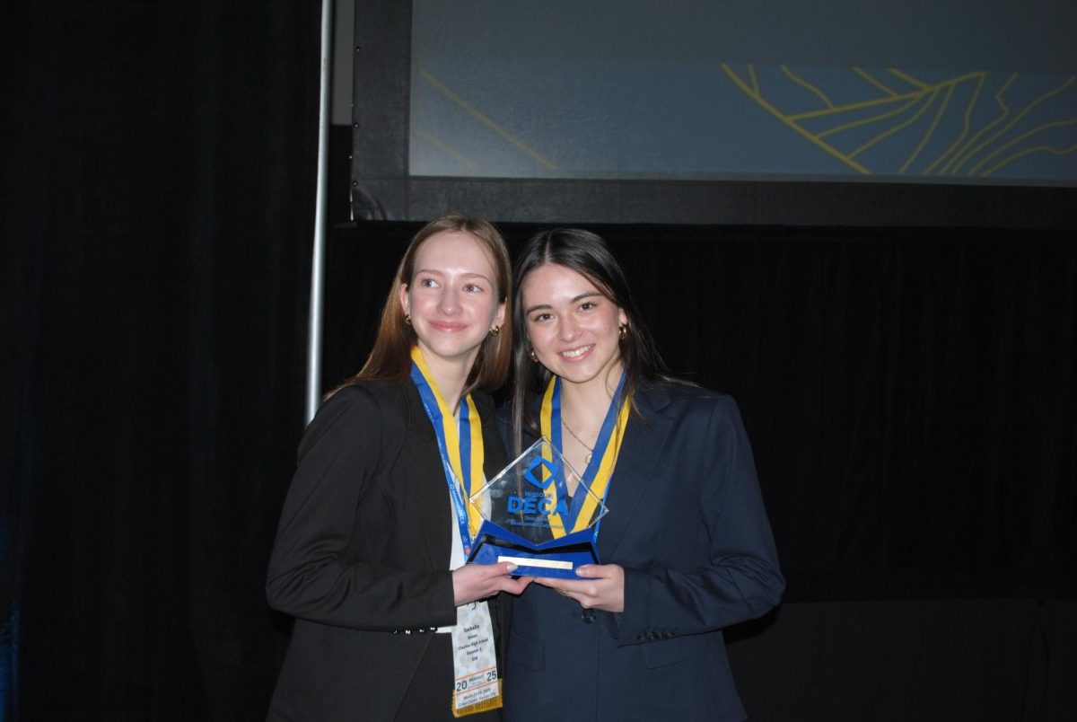 Freshmen Izzy Cuddihee and Isabella Kotets compete in the DECA state competition with their business startup plan on Tuesday, March 25. The pair was surprised to be called up for the top 10 at the awards ceremony. “[The judge] called our presentation ‘very boring and not very good.’ We were in shock after that [and] completely lost hope. Then we were called up for second [place] which was insane,” Cuddihee said.