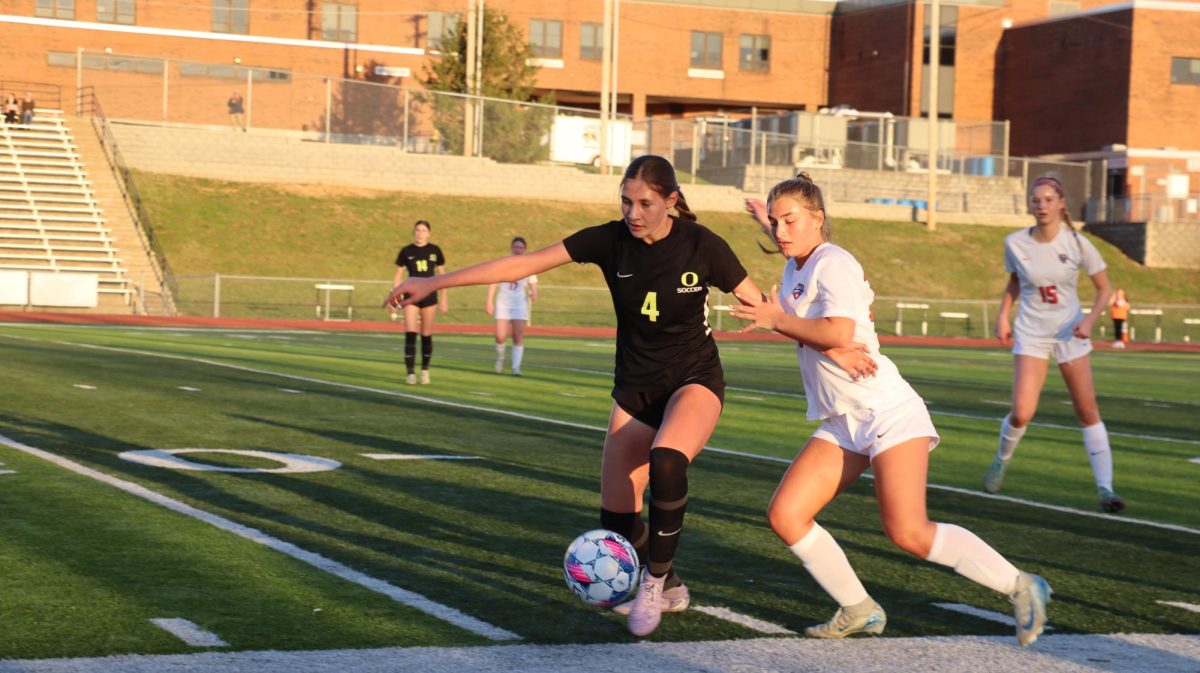 Freshman Izzy Pratl races towards the ball at the girls’ soccer game against Oakville on Wednesday, March 26. The team lost the game 2-3.