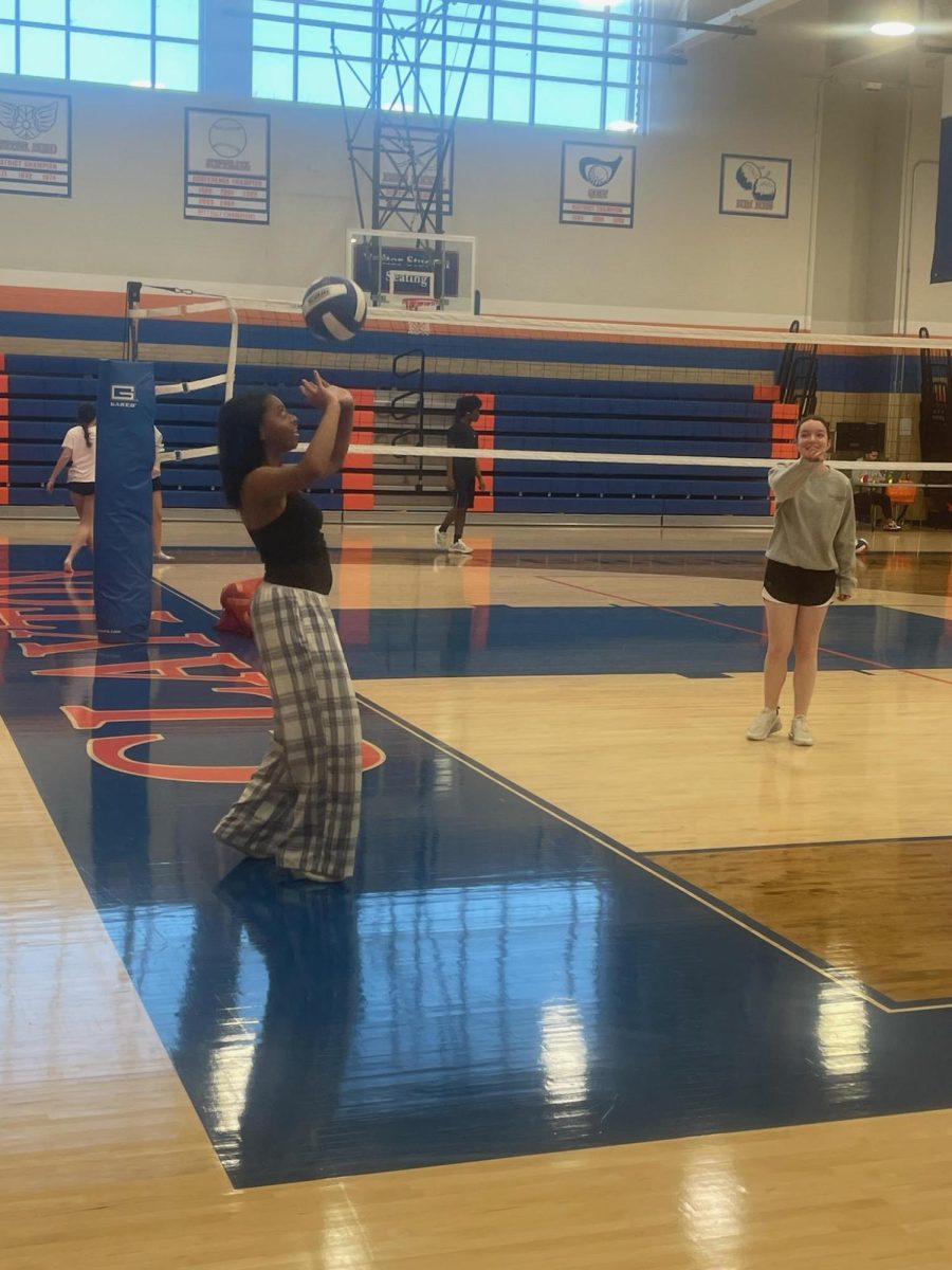 9:20 a.m. 
Freshman Lizzy Littleton sets the ball to pass to freshman Amelia Garavagla. Before the girls started playing the game, they warming up, practicing their sets, dumps and hits. “This volleyball unit has really taught me how to communicate with my classmates, telling them if I have the ball or if them to hit it has helped me with fast communication,” Garavagla said. 