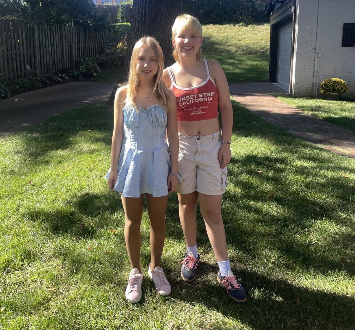 Sophomore Aiden Tavits and Linda Tavits stand in their front yard, pre-tornado. Photo courtesy of Aiden Tavits. 
