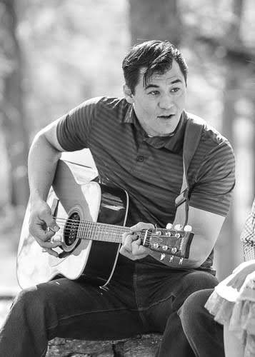 Director of Student Support Michael Siebe plays the guitar with his church. His favorite song to play is, "どんな時でも."