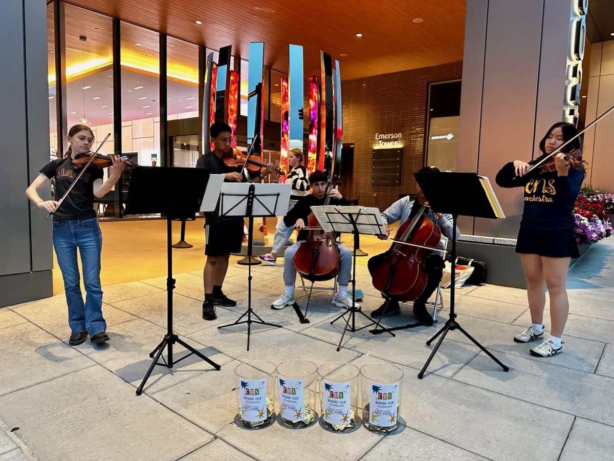 At Clayton’s annual Art Fair, the Buskers Club, consisting of orchestra students, plays for the crowds passing by. Junior Zoe Baldwin played violin, and she felt the joys of playing without the stress of large performance. “I still get a little nervous, but there is no judgment if I mess up. I think people are happy to see young people passionate about music, so it starts to become more about our presence than if we make a mistake or not,” Baldwin said. Photo courtesy of Katherine Nguyen.