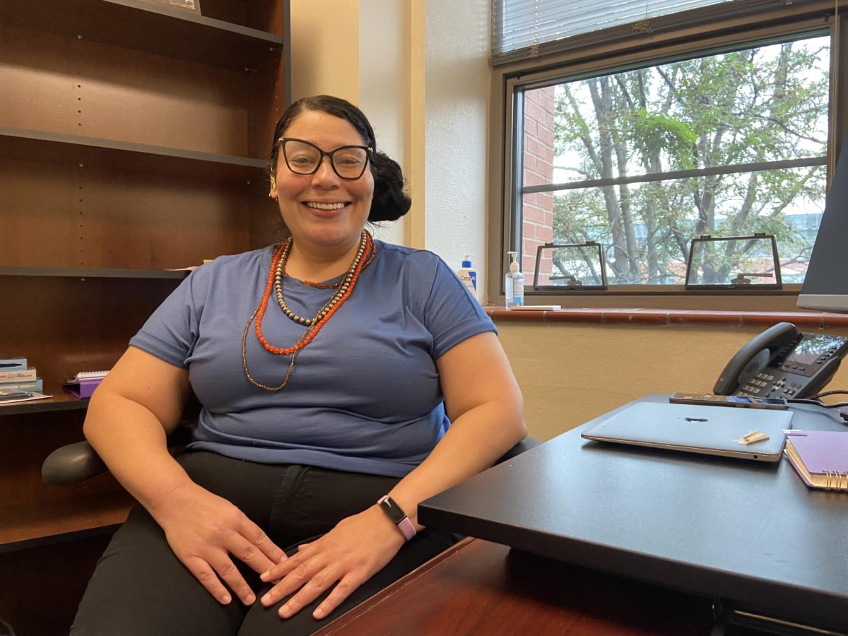 Jenni Todd sits in her office before school starts preparing students schedules.