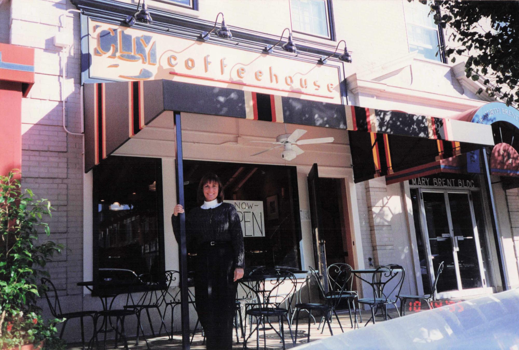 Ann Gallardo poses outside City Coffee & Creperie when it first opened in Clayton. Gallardo founded the cafe in 1995 growing it into a longtime community staple. Photo courtesy of Ann Gallardo