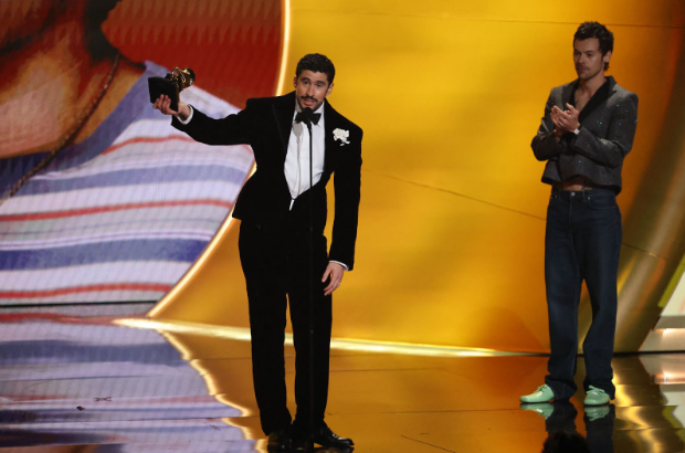 Bad Bunny accepts the award for Album of the Year for "Debi Tirar Mas Fotos" as presenter Harry Styles looks on during the 68th Annual Grammy Awards in Los Angeles, California, U.S., February 1, 2026. REUTERS/Daniel Cole
