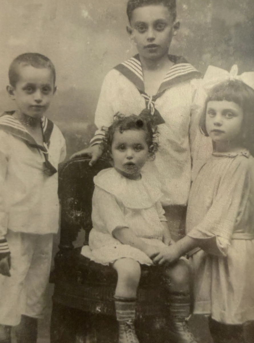 The Neumann family picture shows older brothers Kurt Neumann (standing on the left) and Marcel Neumann (standing in the back), Gerti Neumann (Zoe Shook’s great-grandmother, standing on the right) and her younger sister Meta Neumann (seated).  (Photo courtesy of Jeremy Shook)