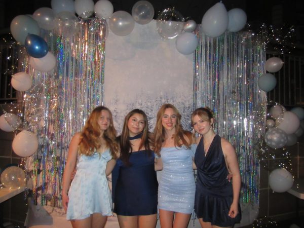 Juniors Genevieve Bueno Perkins, Mariana Paz Gonzalez, Kyra Welton and Ella Edler pose for a picture at the 2026 winter formal photo booth.