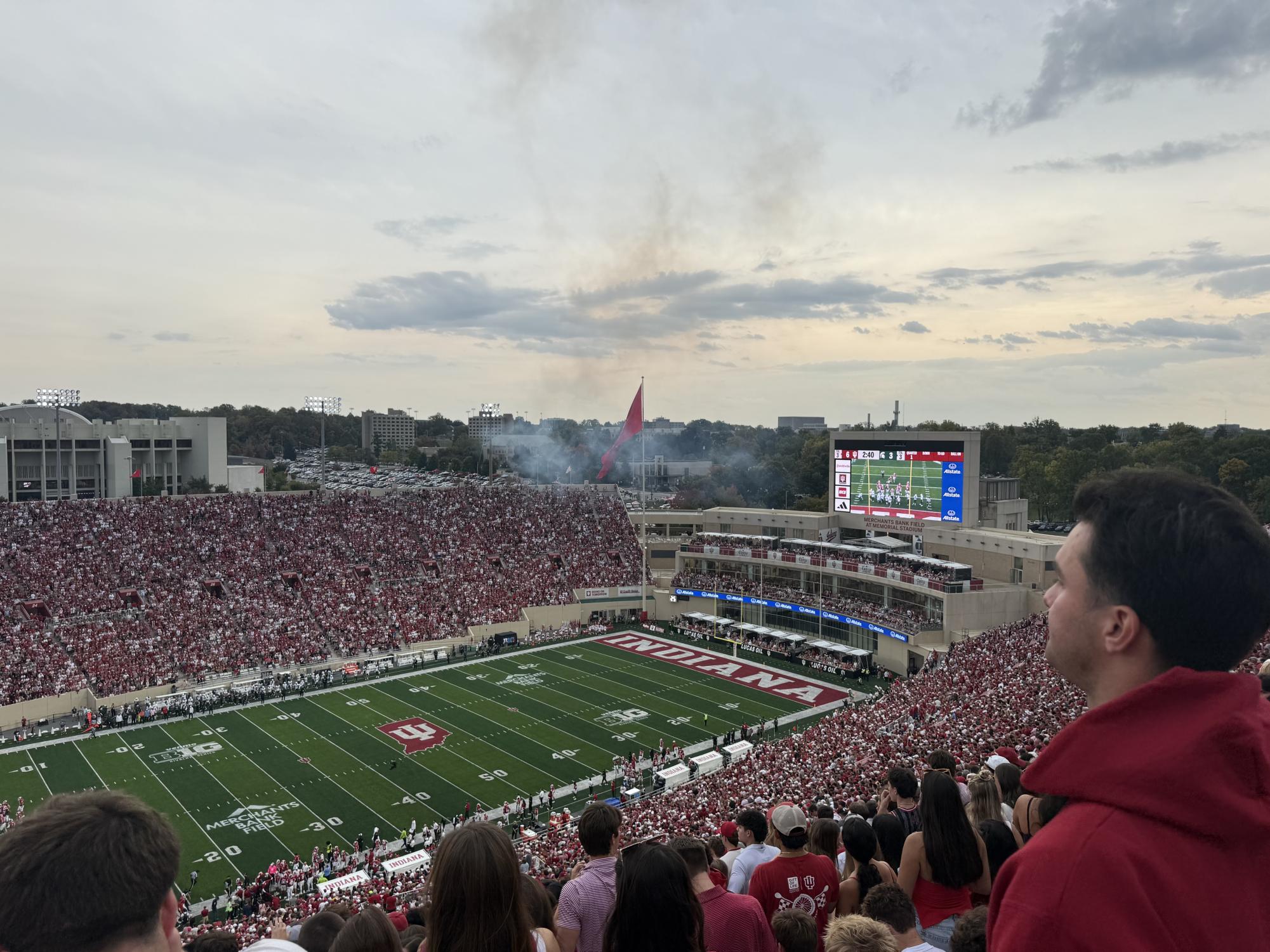 Alumnus Micah Lotsoff and friends rally the student section as they await the home Hoosier's entrance. This victory contributed to a dominant undefeated streak that eventually propelled Indiana to its first-ever state football championship.