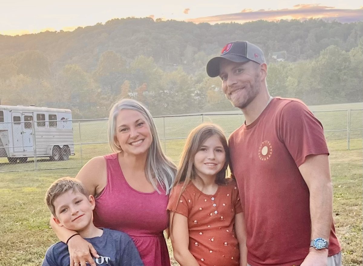 Wyatt LaPierre, literacy teacher Sarah LaPierre, Olivia LaPierre, and Ben LaPierre pose for a family photo while in Jackson, Mississippi. 
