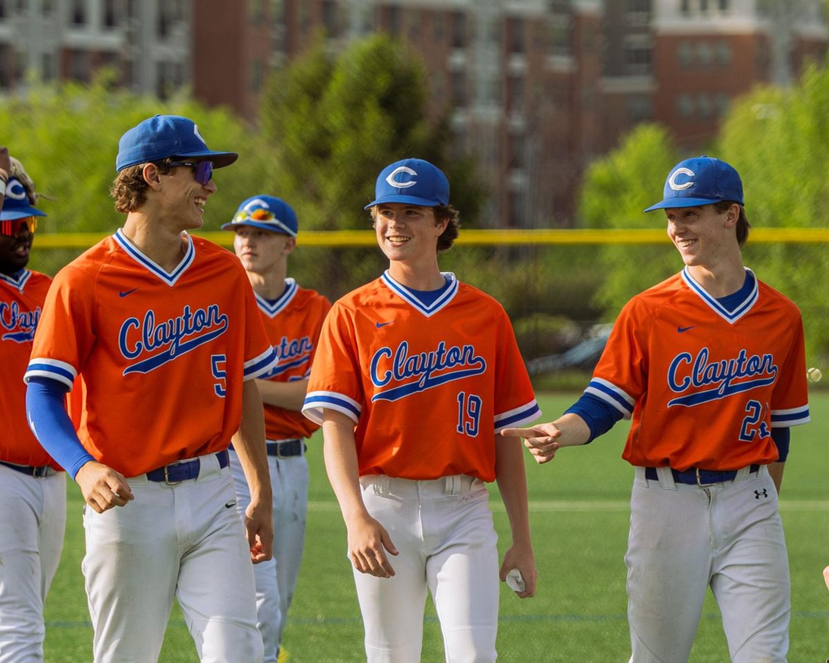 Sophomore Adam Gallegos celebrates with Clayton baseball teammates Nathaniel Booth and Tommy Leary after a 13-1 win against University City High School on April 29, 2024.