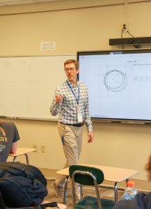 Dorsey teaches his third-period geometry class on Thursday, April 9. "I enjoy that [the students] are willing to get up, work at the whiteboards and collaborate," Dorsey said. 