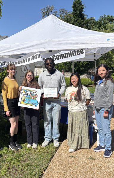 Juniors Lucinda Lloyd and Jaren Han, along with senior Amelia Lewis, pose with the Missouri Bird City certificate at the World Migratory Bird Day event.